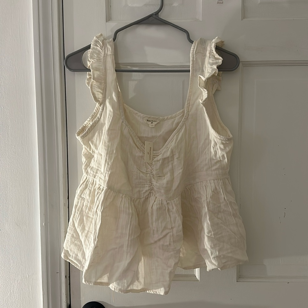 I am selling a beige top from world market that is brand new